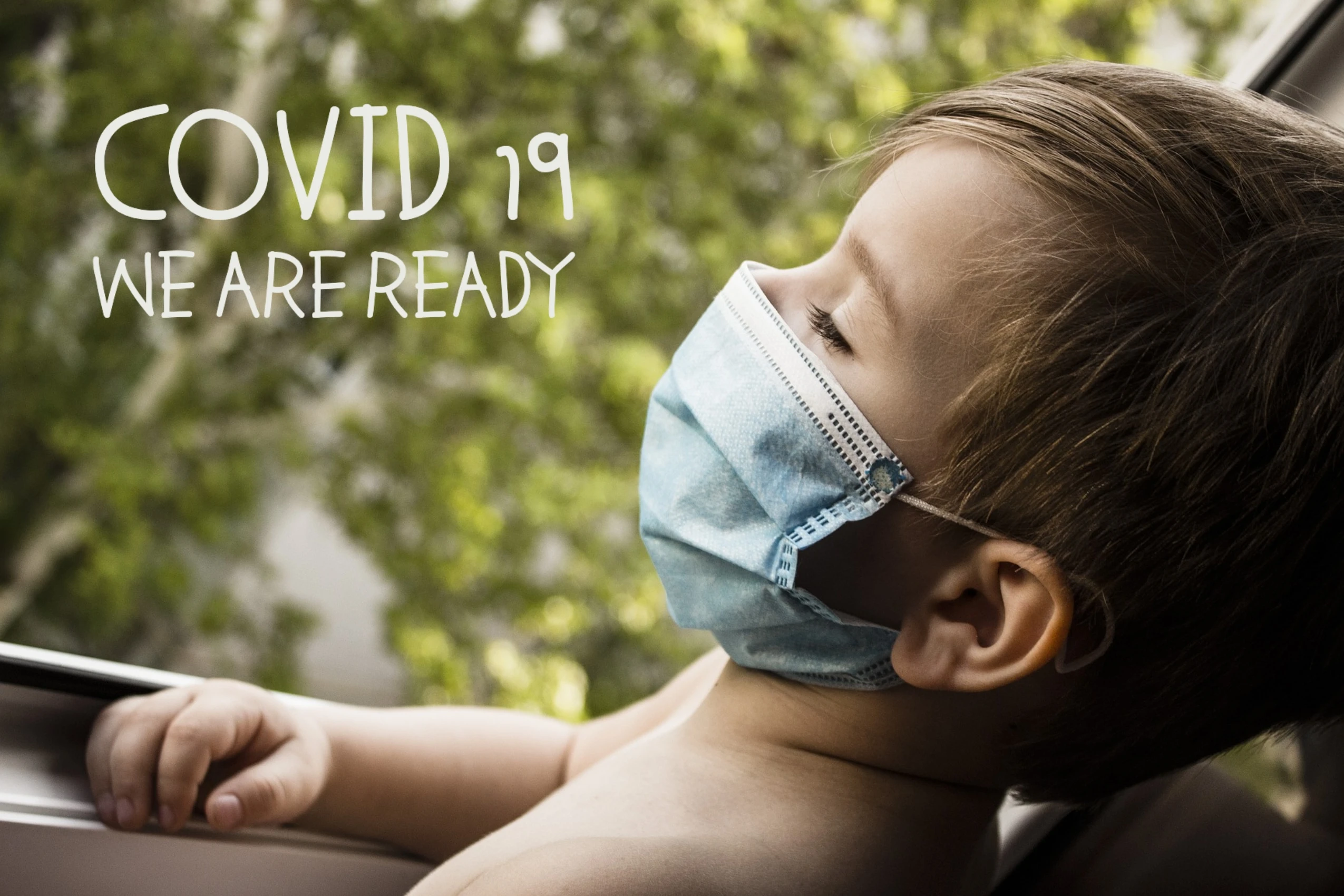 Child with a mask, looking out the window with the text 'COVID 19 We Are Ready'