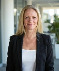 Michelle smiling confidently in a modern office setting