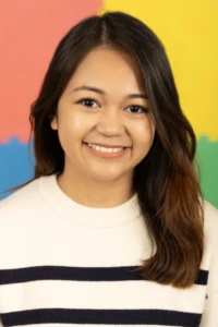 Smiling Alison against a colorful background